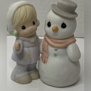 Precious Moments ..little girl with snowman ..Production mark is butterfly